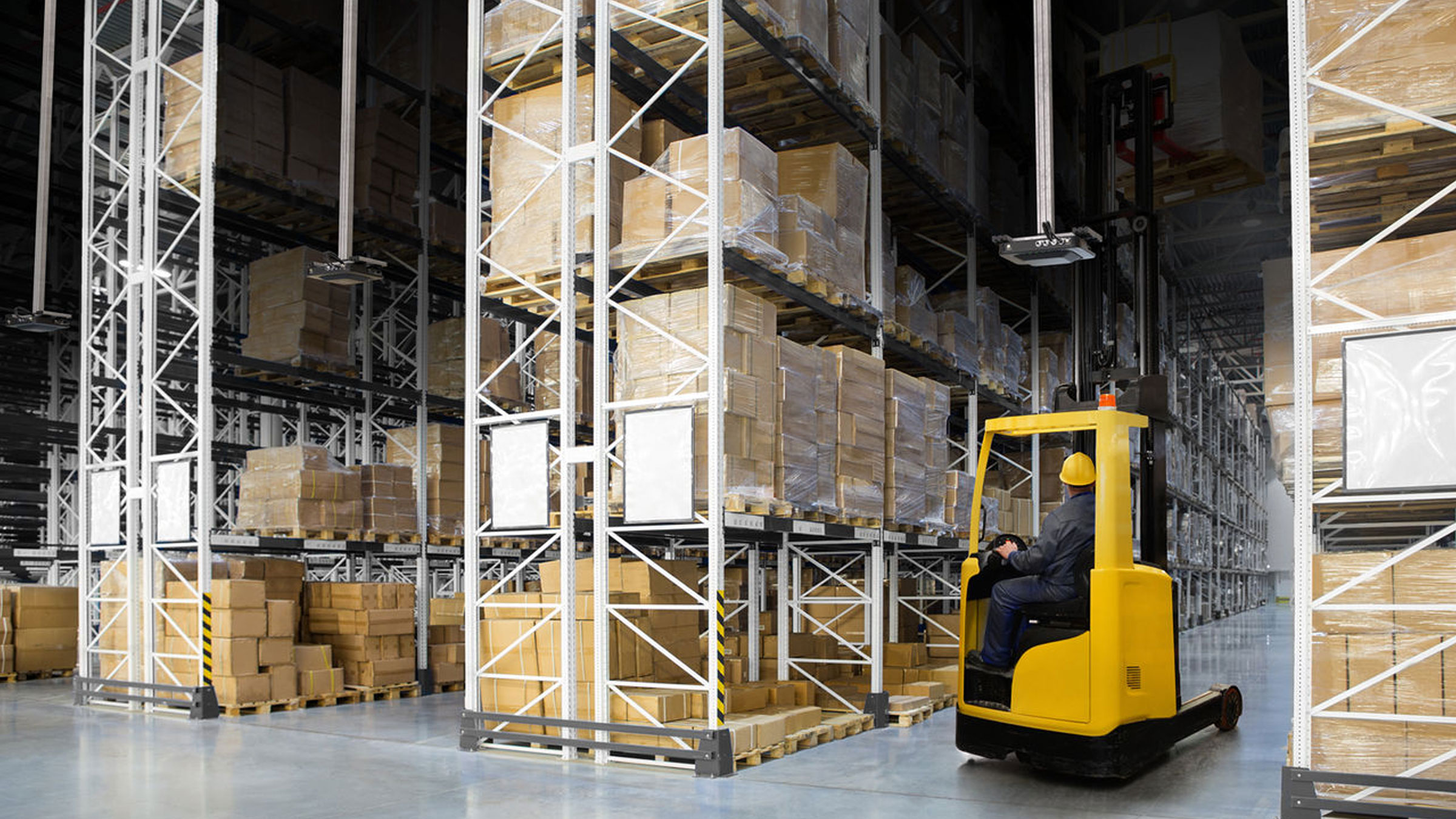 A warehouse forklift operator uses RFID to count inventory