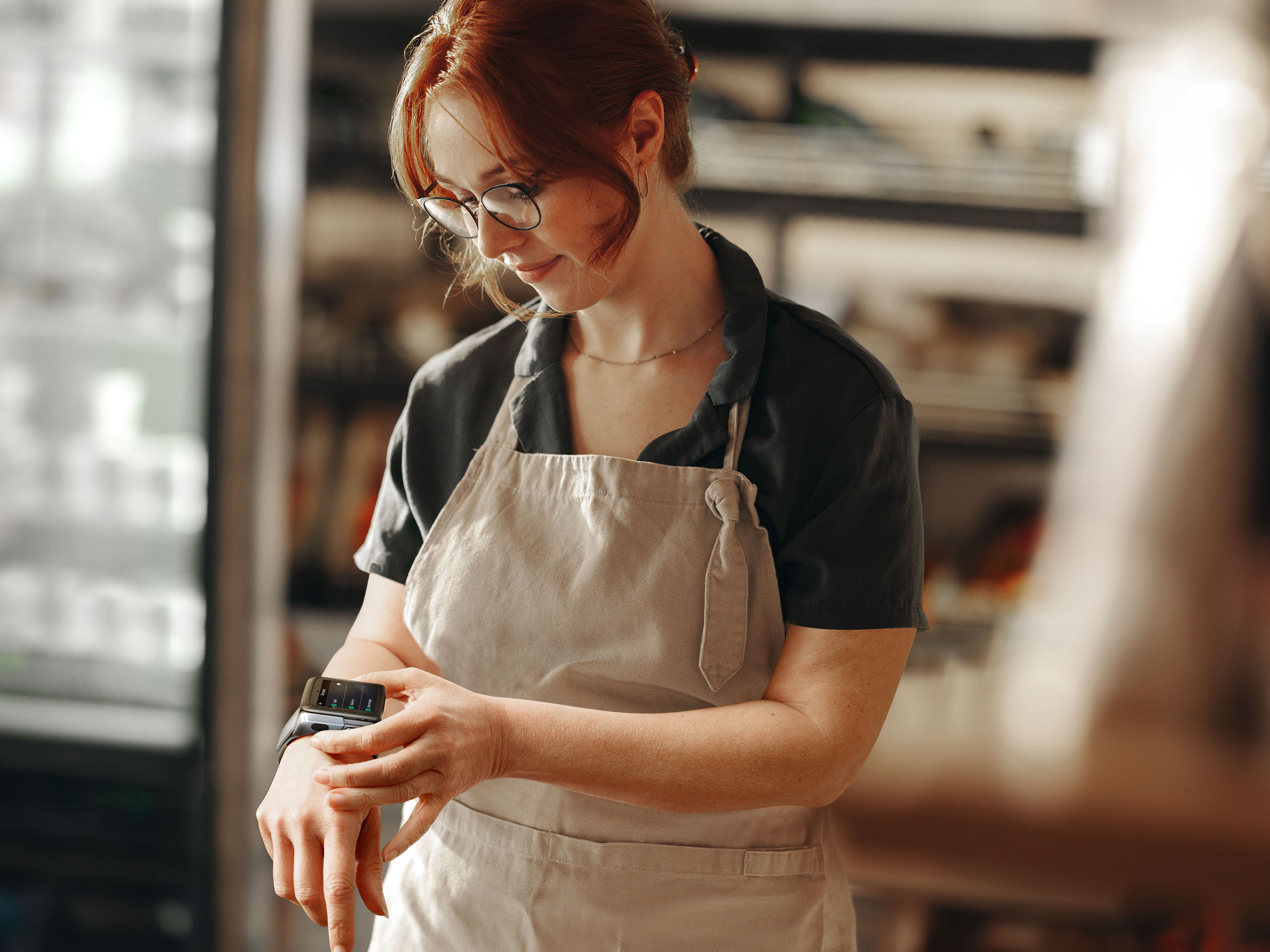 Woman in a bakery with a WS50 on her wrist