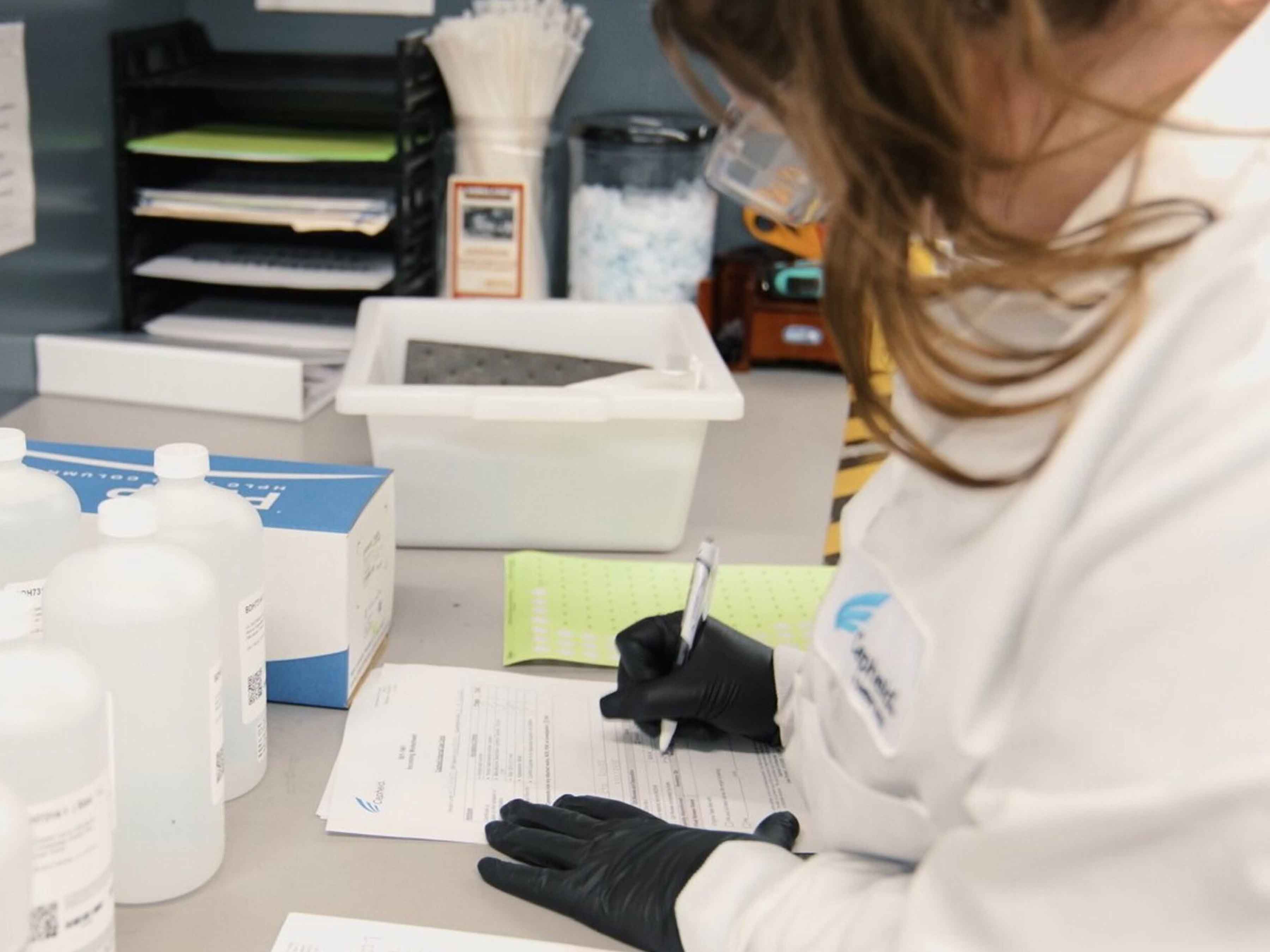 Cepheid Success Story Photo, 4x3, 3600 Healthcare personnel signing off some documents