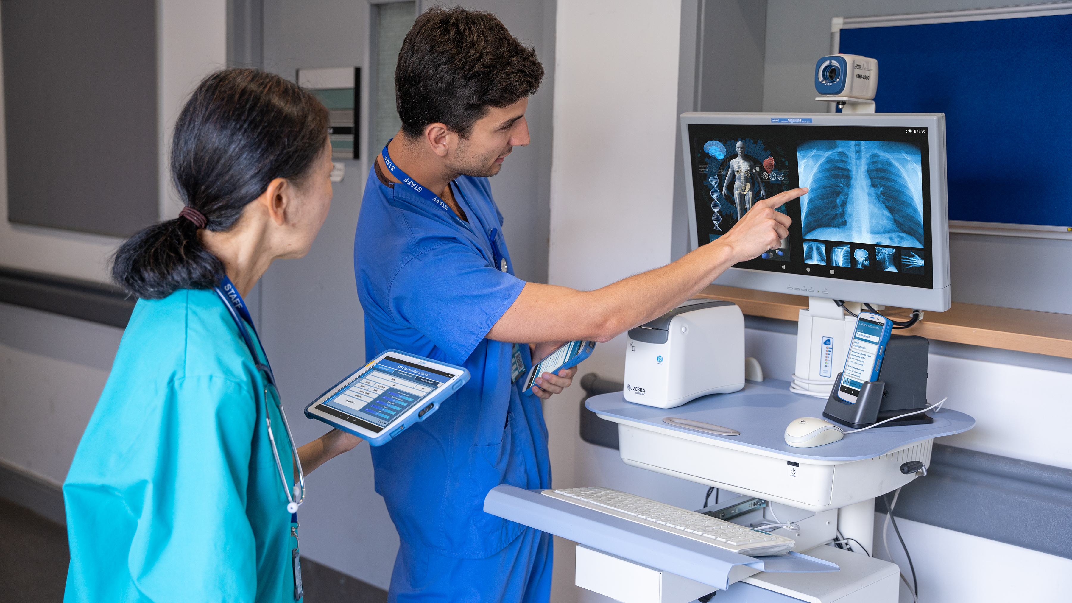 healthcare-photography-website-hc50-ET4x-hc-zd510-hc-connect-cradle-hallway-doctor-nurse-viewing-patient-record-16x9-3600x2025 healthcare-photography-website-hc50-ET4x-hc-zd510-hc-connect-cradle-hallway-doctor-nurse-viewing-patient-record-16x9-3600x2025