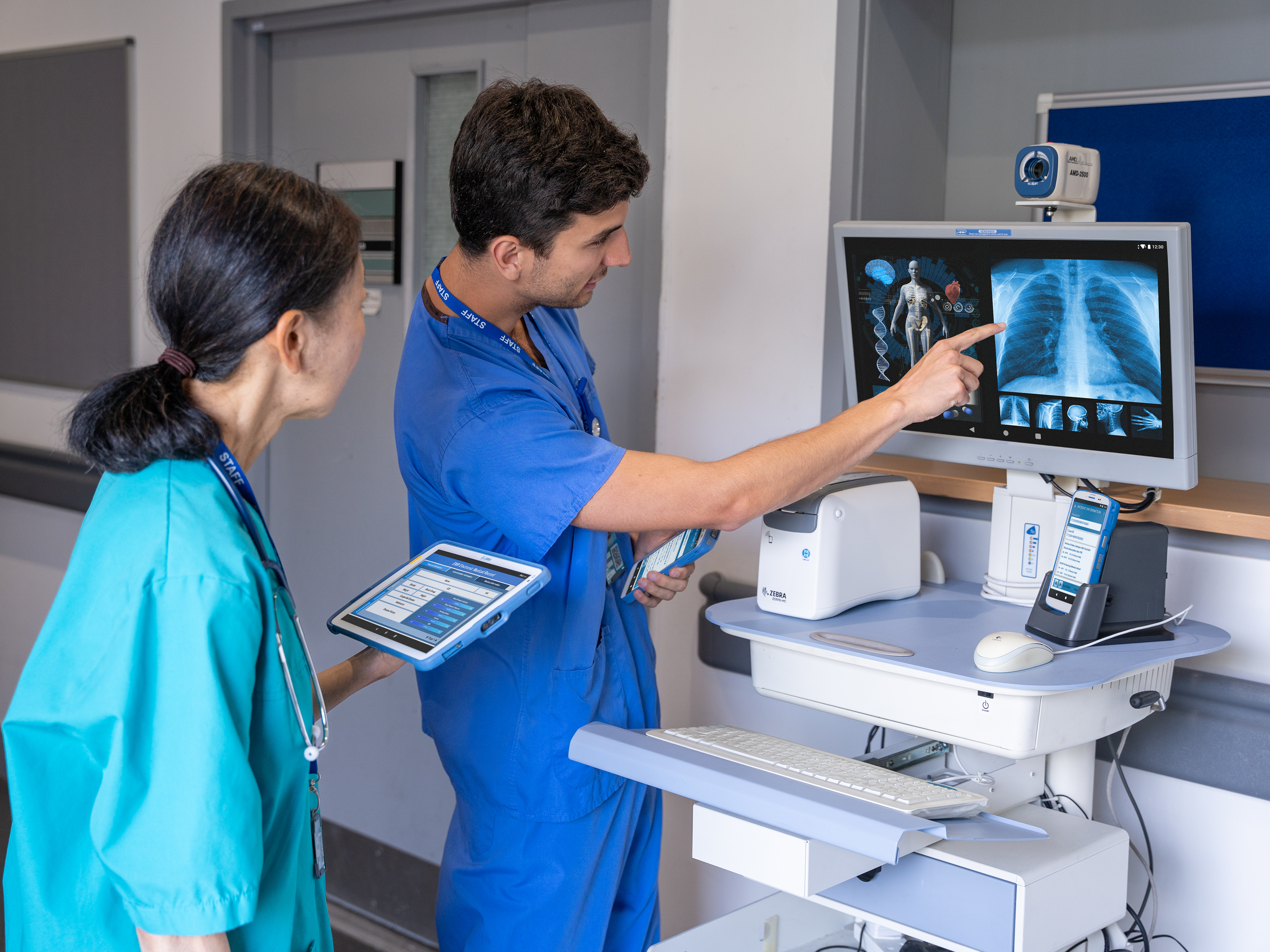healthcare-photography-website-hc50-et4x-hc-zd510-hc-connect-cradle-hallway-doctor-nurse-viewing-patient-record-4x3-3600x2700 healthcare-photography-website-hc50-et4x-hc-zd510-hc-connect-cradle-hallway-doctor-nurse-viewing-patient-record-4x3-3600x2700