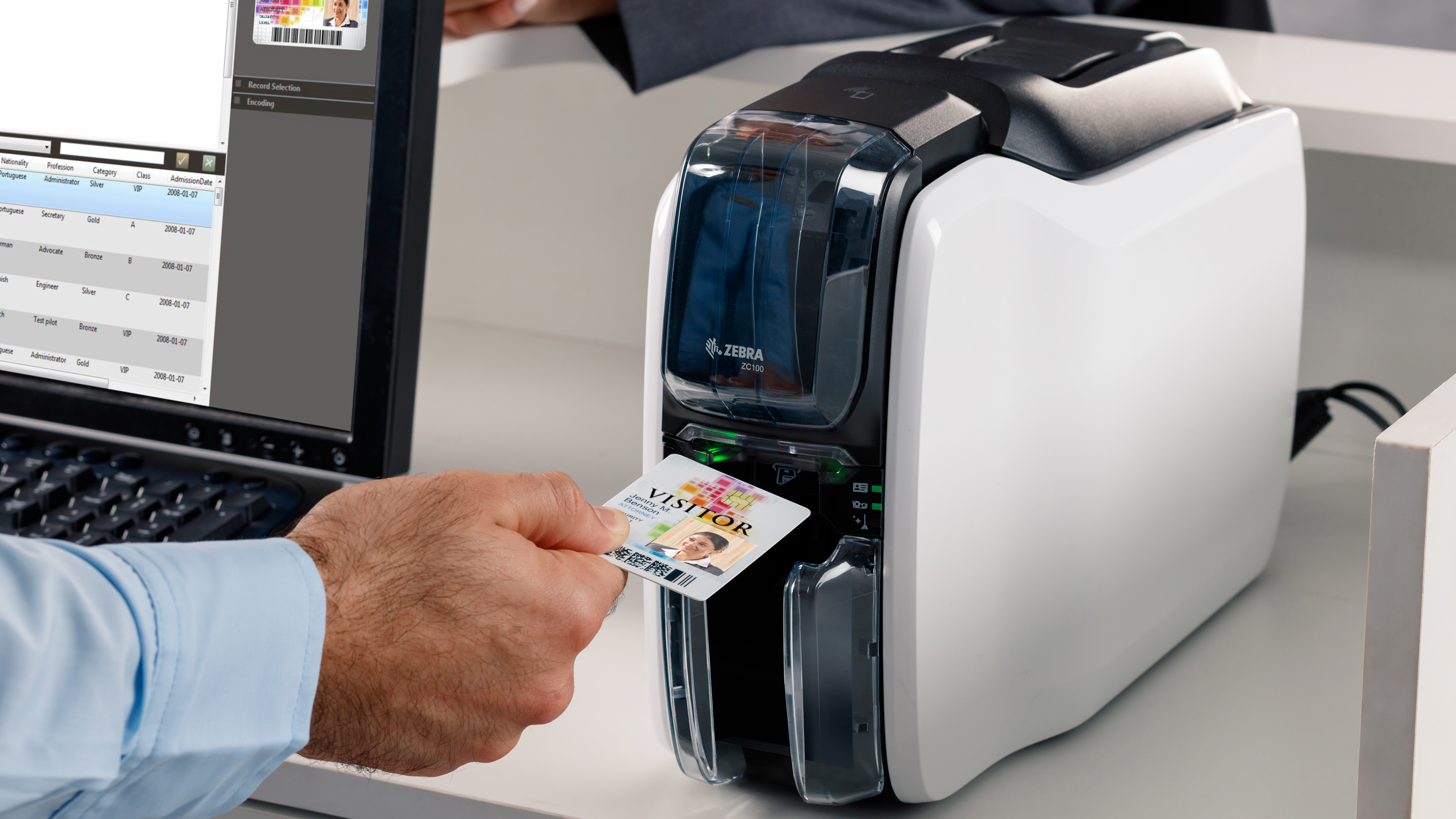 Hospitality employee using a Zebra ID Card Printer to create a visitor ID. Hospitality employee using a Zebra ID Card Printer to create a visitor ID.