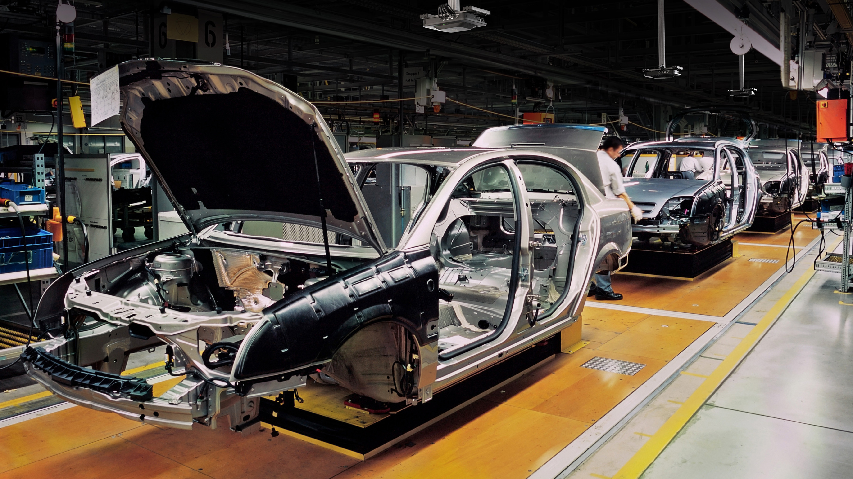Cars being assembled at the factory Cars being assembled at the factory