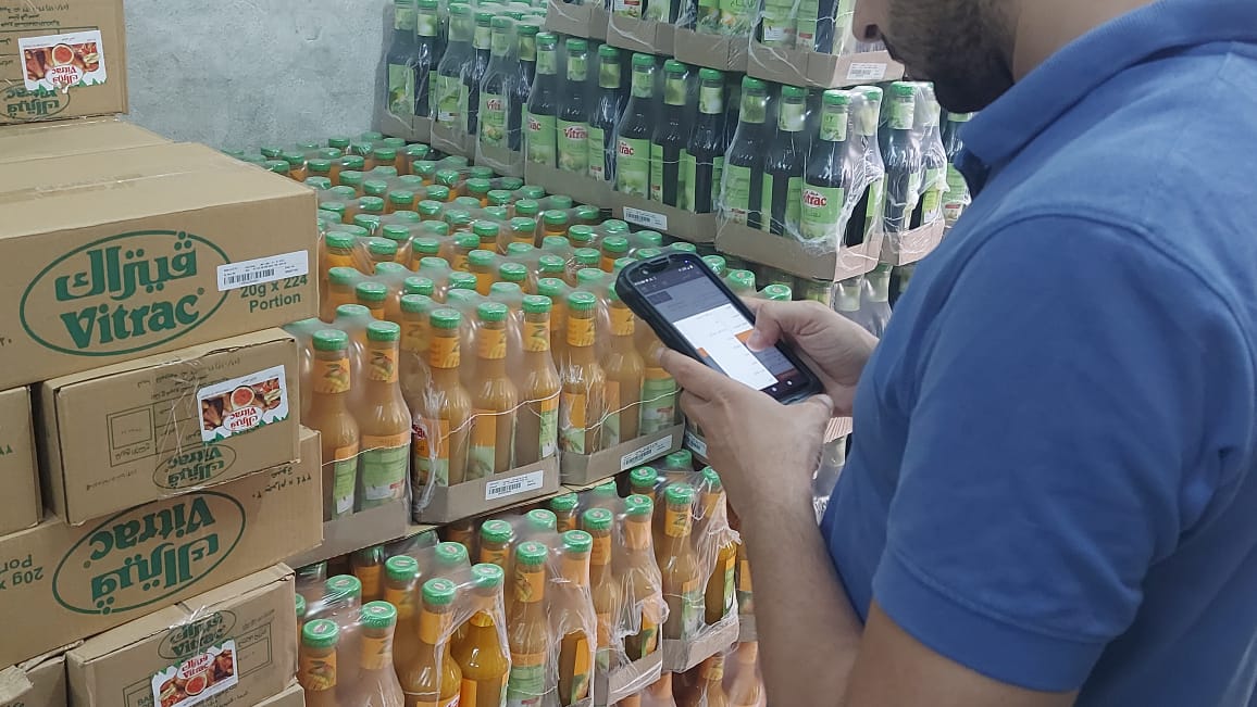 Worker using a handheld mobile computer for inventory. Worker using a handheld mobile computer for inventory.