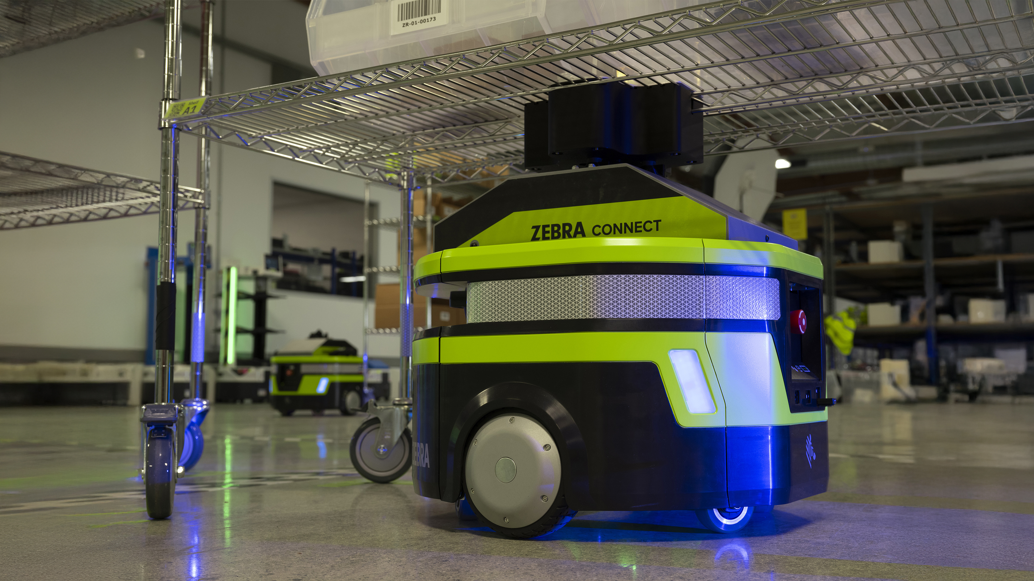 Close-up shot of Zebra mobile robot under the rack Close-up shot of Zebra mobile robot under the rack