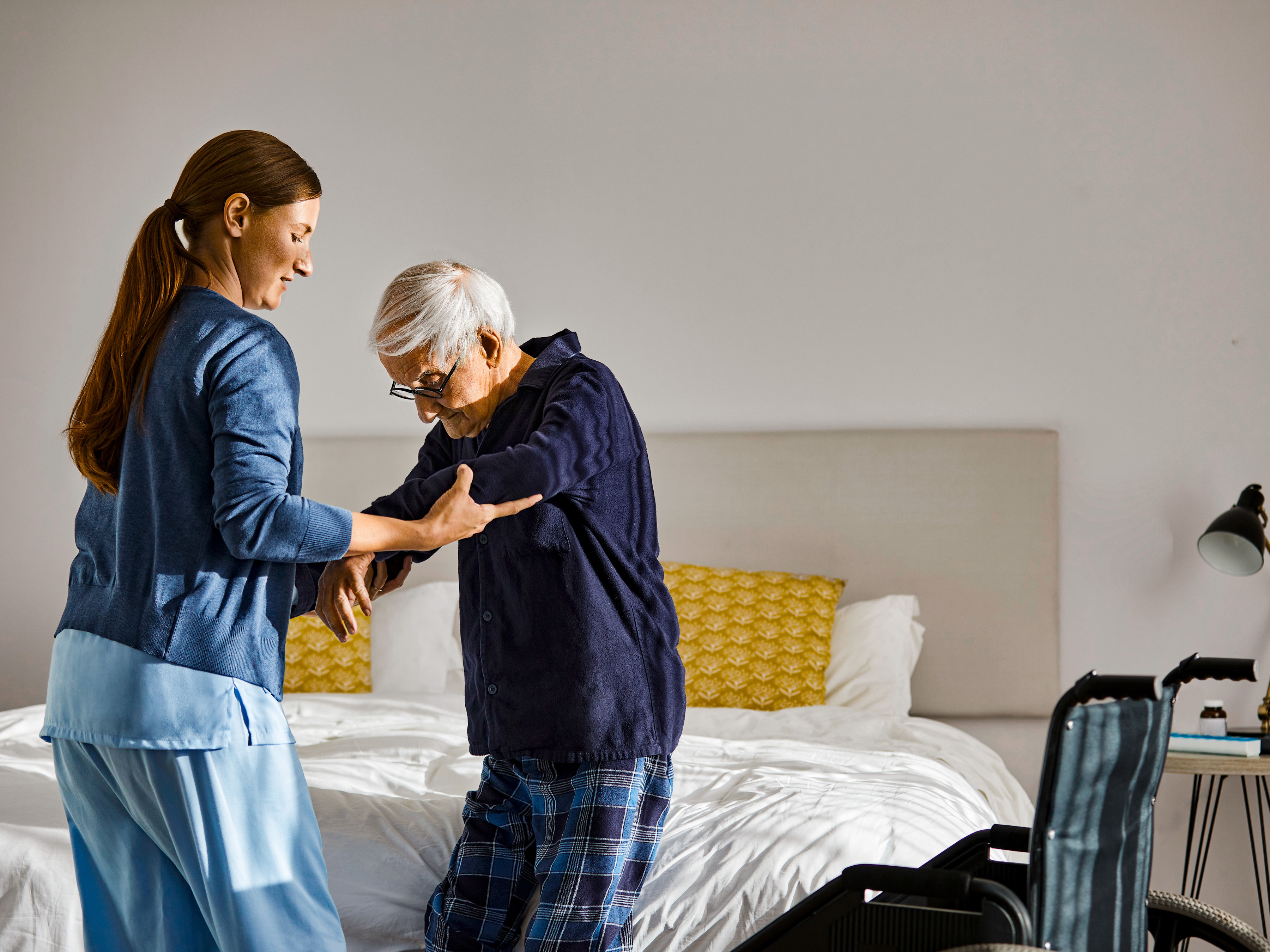 Medical professional assisting a patient at home.  Medical professional assisting a patient at home.