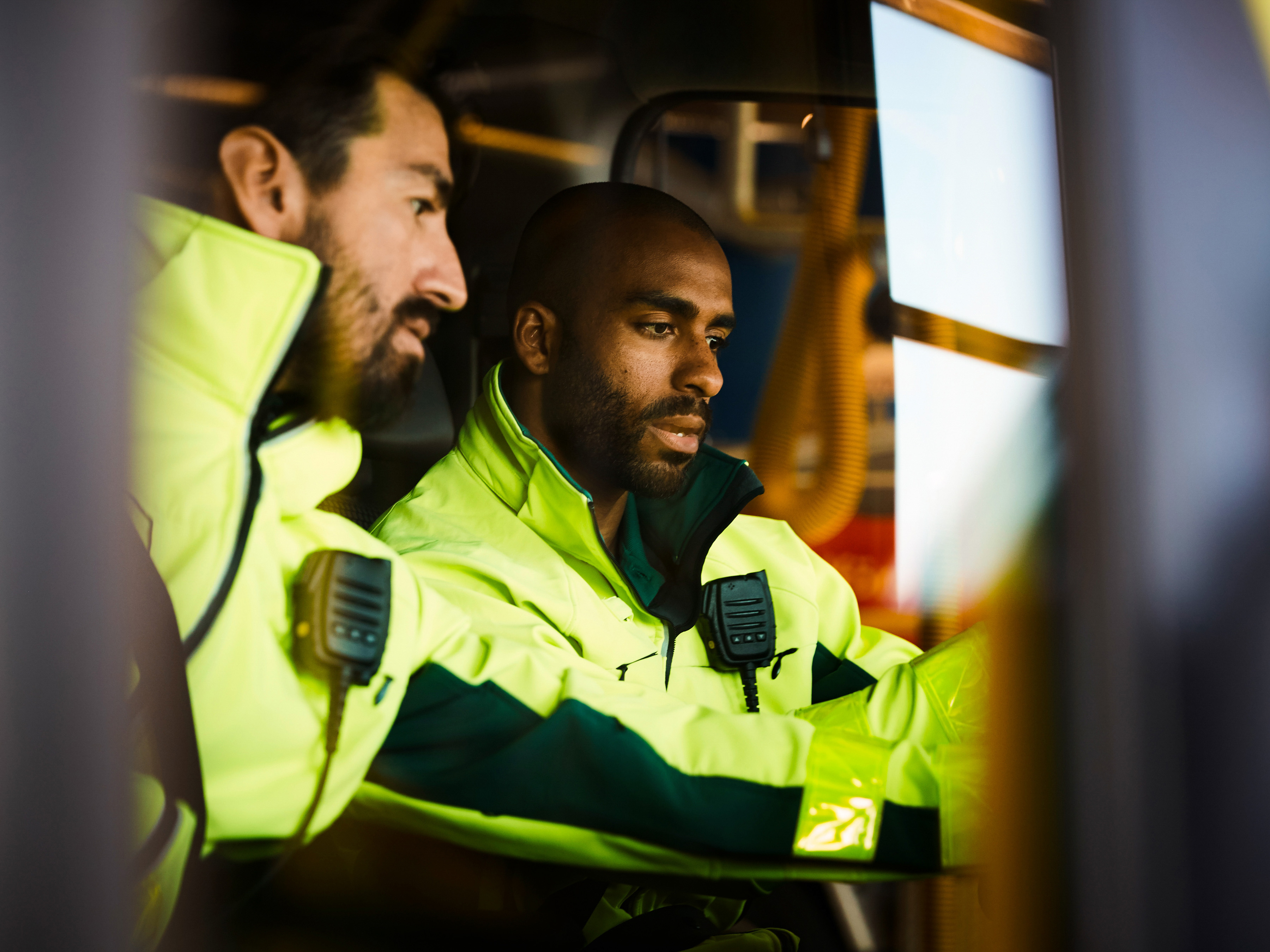 First responders sitting in work vehicle.  First responders sitting in work vehicle.