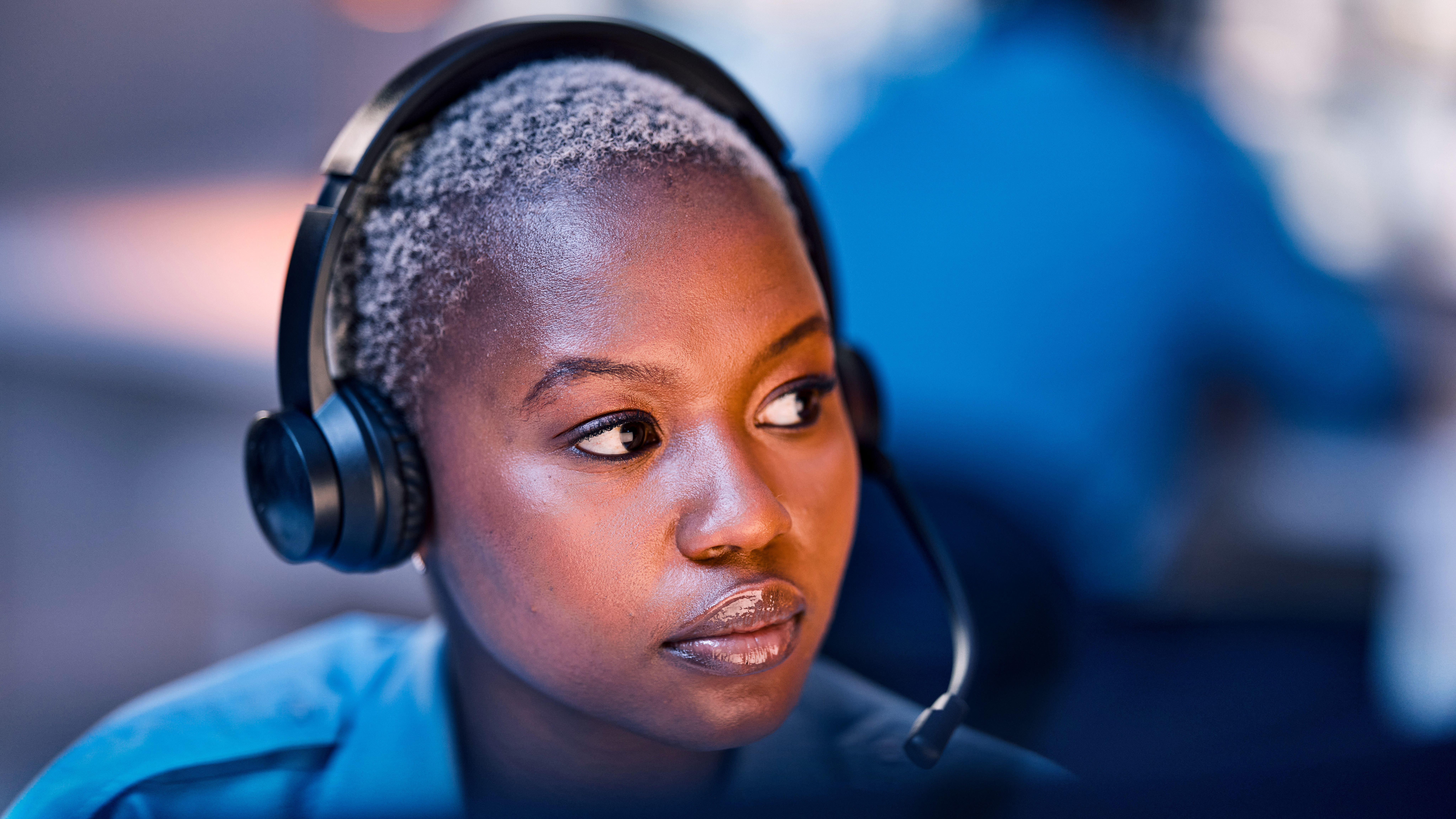 Employee wearing a headset. Employee wearing a headset.